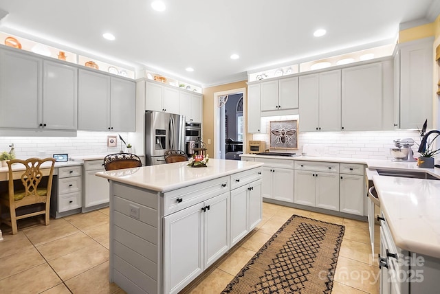 15933 Glen Miro Dr, Huntersville, NC 28078 - kitchen with stainless steel appliances, backsplash, light tile patterned flooring, a kitchen island, and recessed lighting