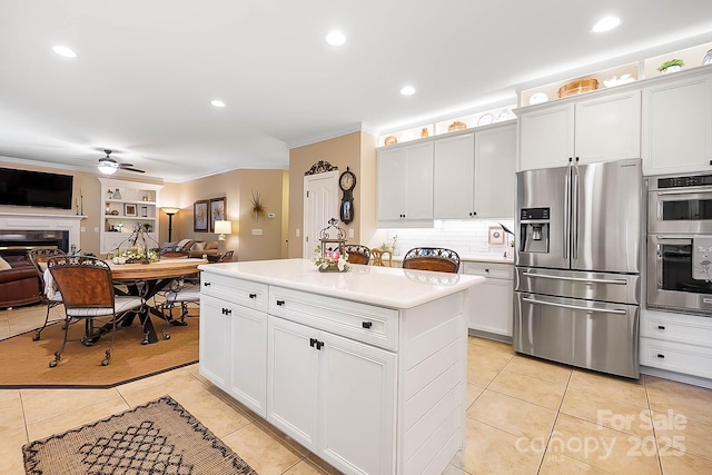 15933 Glen Miro Dr, Huntersville, NC 28078 - kitchen with appliances with stainless steel finishes, open floor plan, light tile patterned flooring, ornamental molding, and ceiling fan