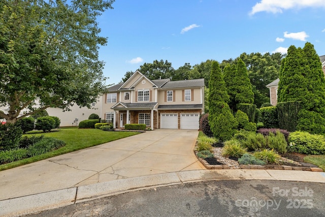 1504 Jekyll Ln, Waxhaw, NC 28173 - view of front of house with concrete driveway, an attached garage, and a front yard