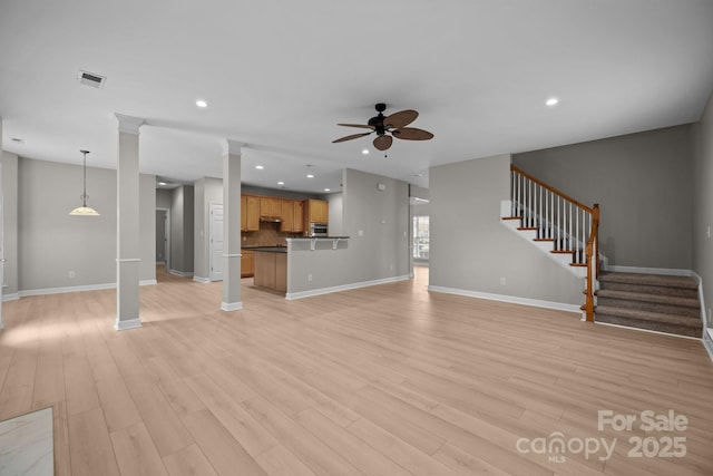 1504 Jekyll Ln, Waxhaw, NC 28173 - unfurnished living room with ceiling fan, light wood-type flooring, stairway, and recessed lighting