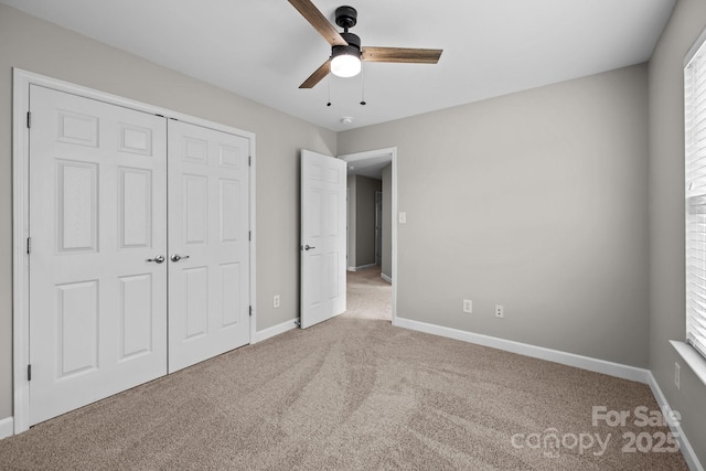 1504 Jekyll Ln, Waxhaw, NC 28173 - unfurnished bedroom with carpet, a closet, and ceiling fan