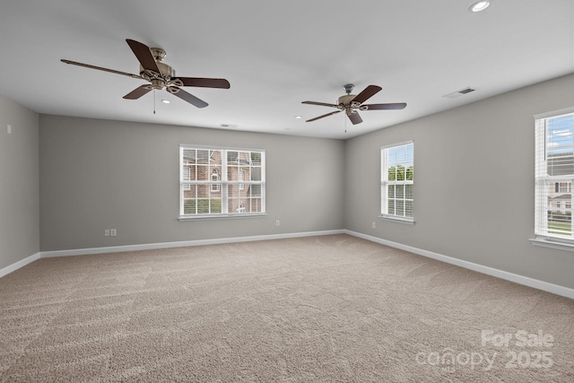 1504 Jekyll Ln, Waxhaw, NC 28173 - empty room with healthy amount of natural light, carpet floors, recessed lighting, and a ceiling fan
