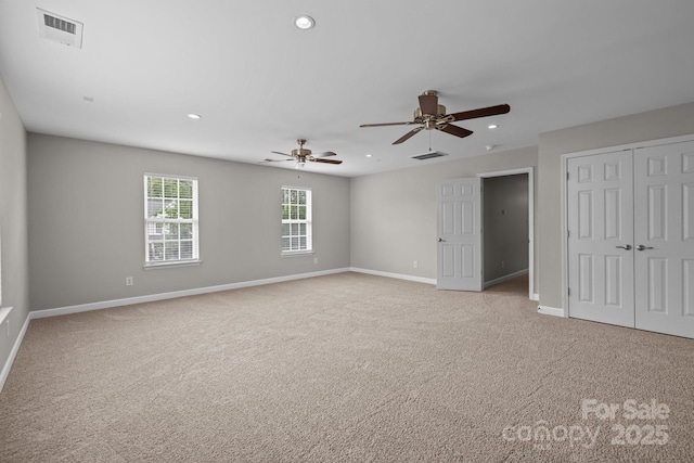 1504 Jekyll Ln, Waxhaw, NC 28173 - unfurnished bedroom with recessed lighting, light colored carpet, a closet, and a ceiling fan