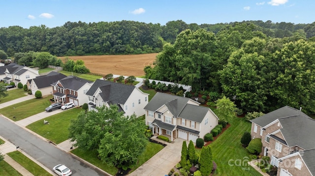 1504 Jekyll Ln, Waxhaw, NC 28173 - aerial perspective of suburban area featuring a heavily wooded area