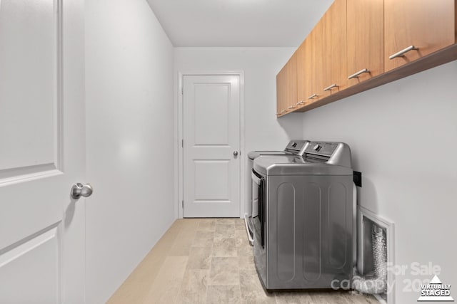 712 Coventry Dr, Albemarle, NC 28001 - washroom featuring cabinet space and washer and clothes dryer