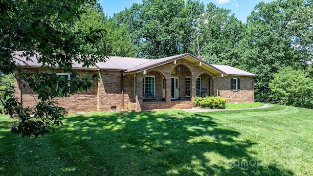 1560 Lafayette Ave, Hudson, NC 28638 - ranch-style home with brick siding, a front yard, and a metal roof