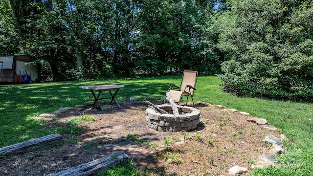 1560 Lafayette Ave, Hudson, NC 28638 - view of green lawn with a fire pit