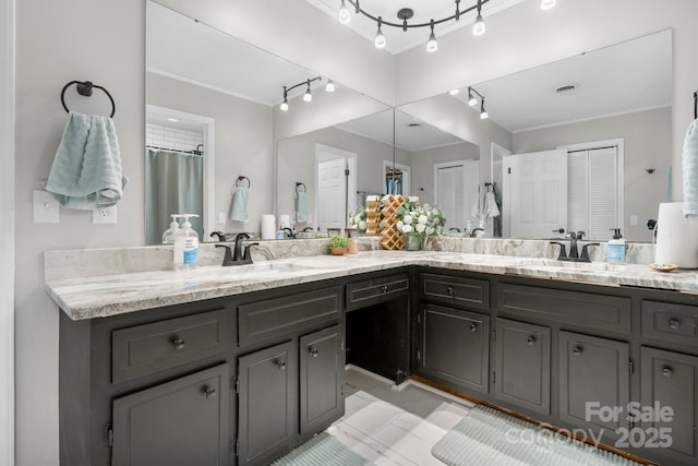 1560 Lafayette Ave, Hudson, NC 28638 - bathroom featuring double vanity, rail lighting, and crown molding