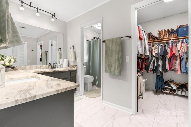 1560 Lafayette Ave, Hudson, NC 28638 - bathroom with marble look tile flooring, ornamental molding, vanity, and a walk in closet