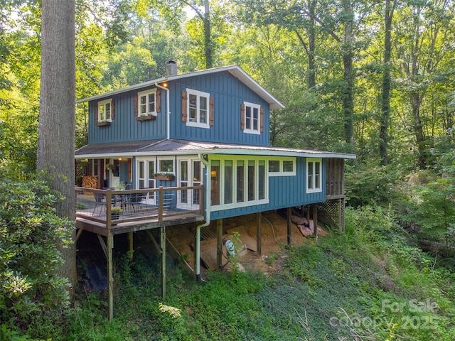 590 Claude Cook Rd, Sylva, NC 28779 - back of house with a deck, a metal roof, a forest view, board and batten siding, and a standing seam roof