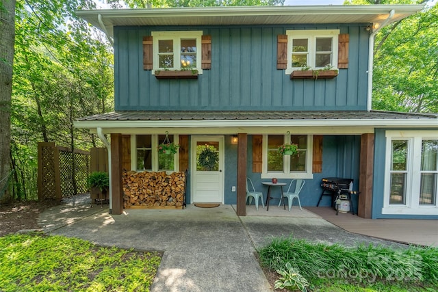 590 Claude Cook Rd, Sylva, NC 28779 - view of front of home featuring board and batten siding, covered porch, and a metal roof