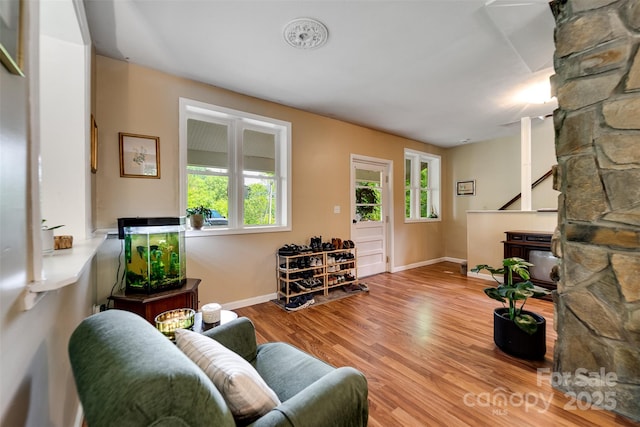 590 Claude Cook Rd, Sylva, NC 28779 - living room with stairway, plenty of natural light, and wood finished floors
