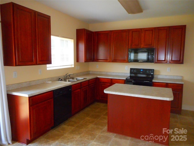 15321 Superior St, Charlotte, NC 28273 - kitchen with black appliances, reddish brown cabinets, light countertops, and a center island