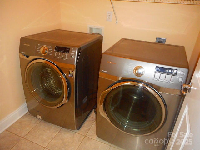15321 Superior St, Charlotte, NC 28273 - washroom featuring washing machine and clothes dryer and light tile patterned flooring