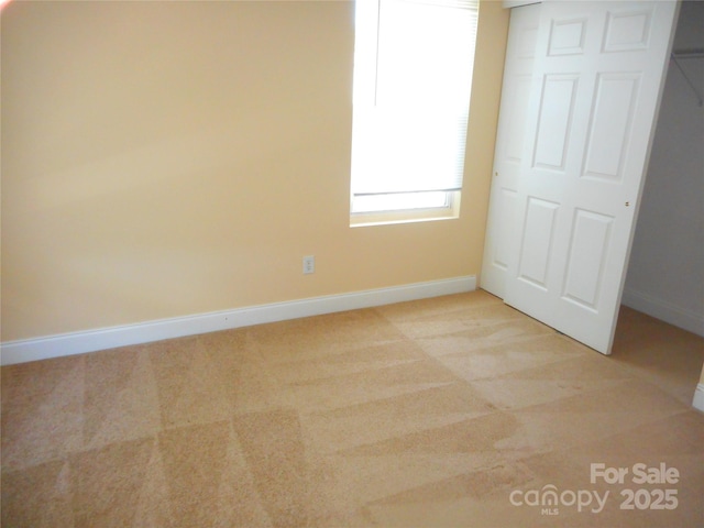 15321 Superior St, Charlotte, NC 28273 - unfurnished bedroom with baseboards and light carpet
