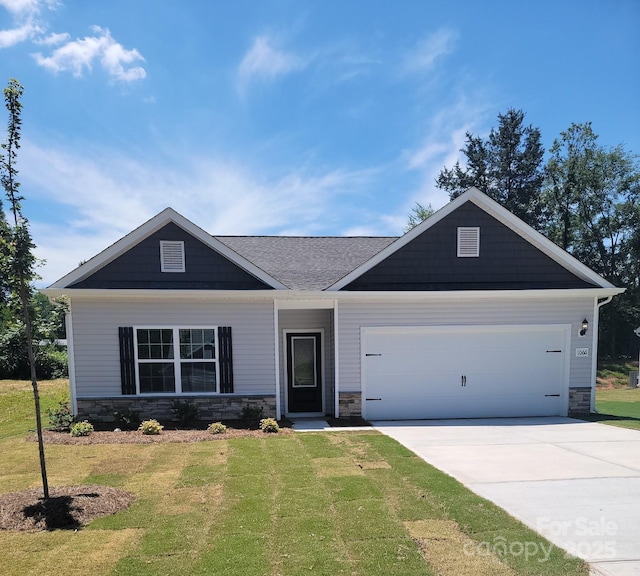 1066 Russell Dr, Winston Salem, NC 27127 - craftsman-style house featuring stone siding, concrete driveway, and a front lawn