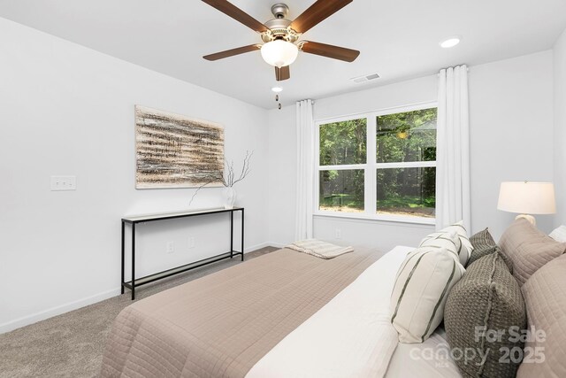 4468 Pebblebrook Cir SW, Concord, NC 28027 - carpeted bedroom featuring baseboards and a ceiling fan