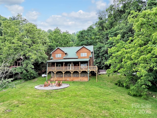 1064 Point Of View Dr, Waynesville, NC 28785 - back of property with a yard, a metal roof, a patio area, and a deck