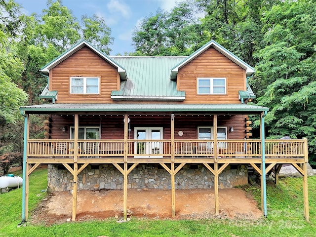 1064 Point Of View Dr, Waynesville, NC 28785 - view of front of house featuring a deck, log exterior, and a metal roof