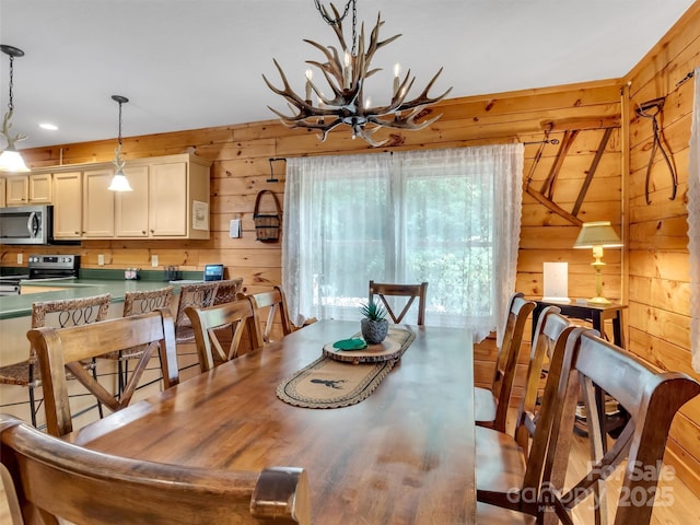 1064 Point Of View Dr, Waynesville, NC 28785 - dining space featuring a chandelier, wooden walls, and recessed lighting