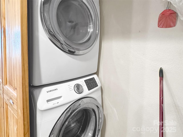 1064 Point Of View Dr, Waynesville, NC 28785 - laundry room featuring stacked washer / drying machine