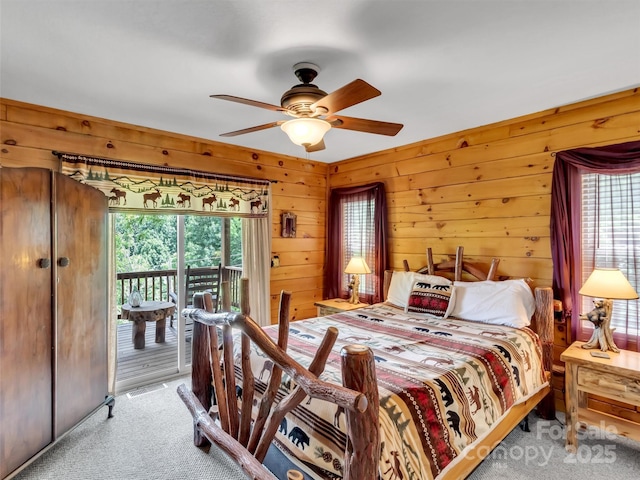 1064 Point Of View Dr, Waynesville, NC 28785 - bedroom with access to outside, carpet flooring, wooden walls, and a ceiling fan