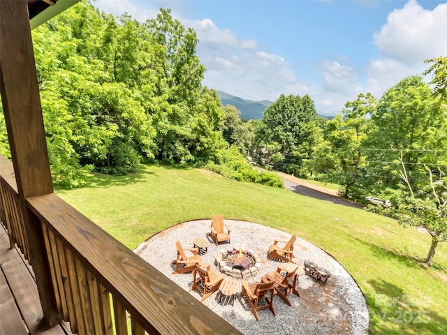 1064 Point Of View Dr, Waynesville, NC 28785 - view of green lawn featuring an outdoor fire pit and a mountain view