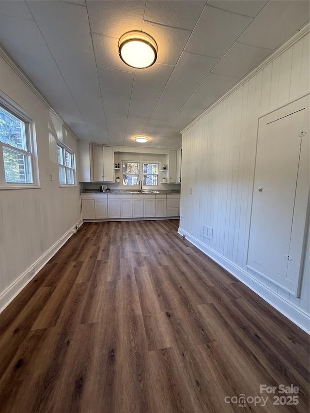 727 3rd Ave NW, Hickory, NC 28601 - unfurnished dining area with dark wood-style floors and baseboards