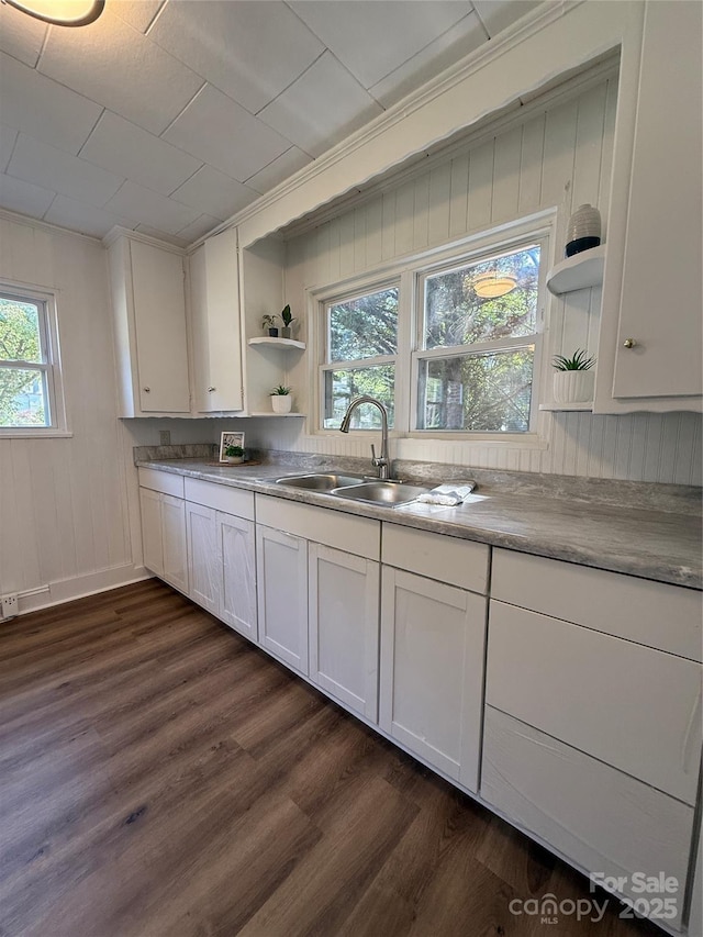 727 3rd Ave NW, Hickory, NC 28601 - kitchen with open shelves, dark wood finished floors, white cabinets, and wood walls