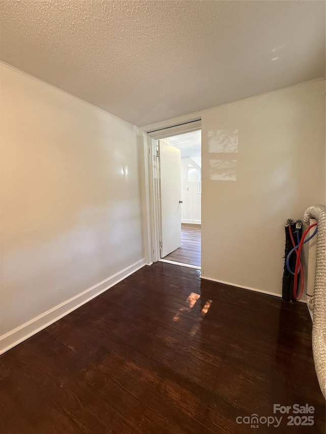 727 3rd Ave NW, Hickory, NC 28601 - unfurnished room featuring wood finished floors and a textured ceiling