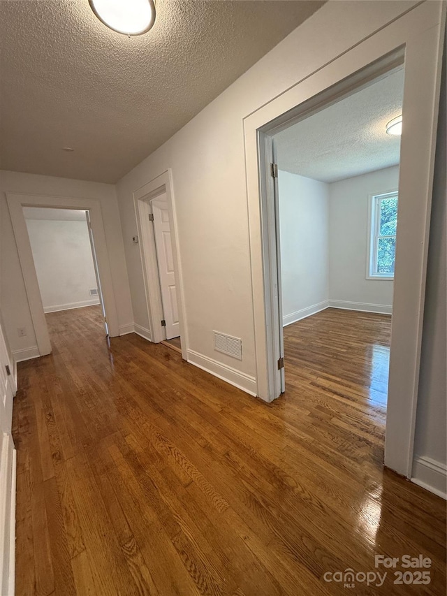 727 3rd Ave NW, Hickory, NC 28601 - hallway featuring a textured ceiling and wood finished floors