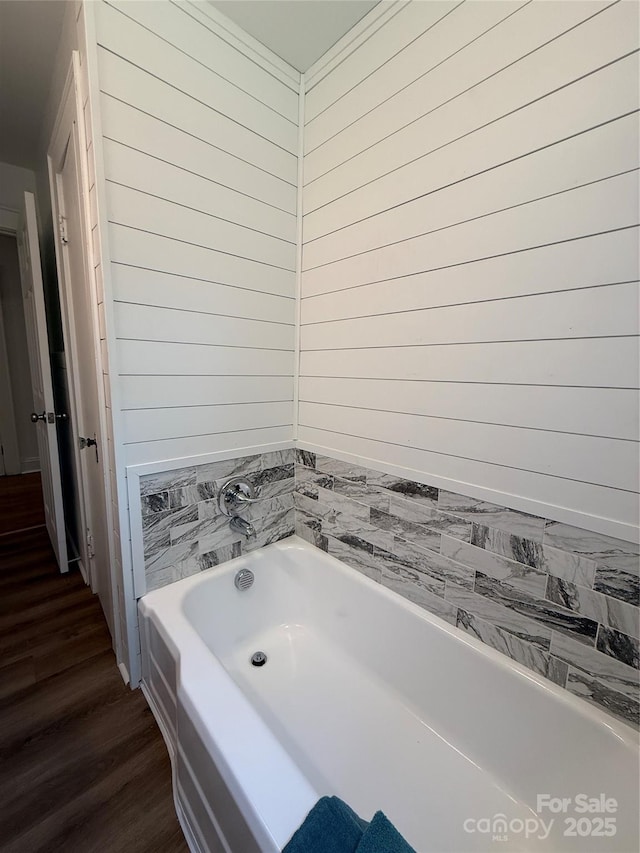 727 3rd Ave NW, Hickory, NC 28601 - bathroom featuring a garden tub and wood finished floors