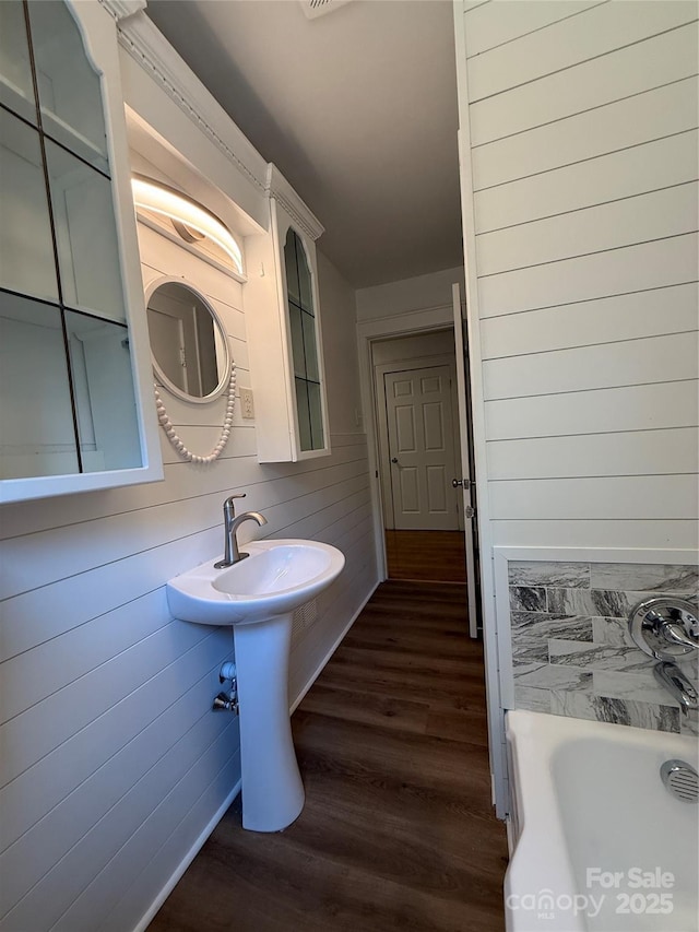727 3rd Ave NW, Hickory, NC 28601 - bathroom with wood finished floors and a tub to relax in