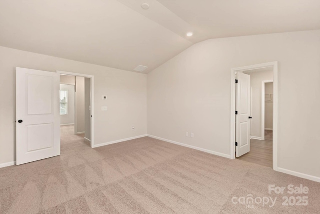 1070 Jonestown Rd, Winston Salem, NC 27127 - carpeted spare room with vaulted ceiling and baseboards