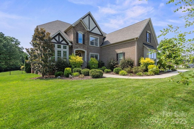 805 Hidden Pond Ln, Waxhaw, NC 28173 - tudor-style house with roof with shingles and brick siding