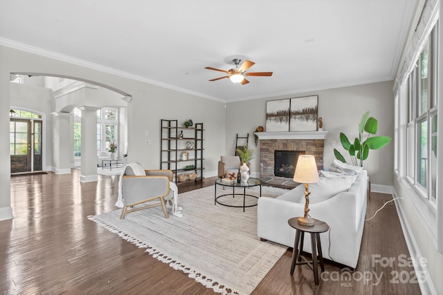 805 Hidden Pond Ln, Waxhaw, NC 28173 - living room featuring ornate columns, arched walkways, healthy amount of natural light, ceiling fan, and ornamental molding
