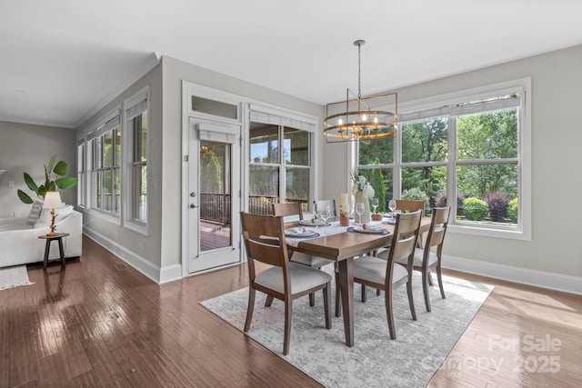 805 Hidden Pond Ln, Waxhaw, NC 28173 - dining area featuring a chandelier, hardwood / wood-style flooring, and ornamental molding