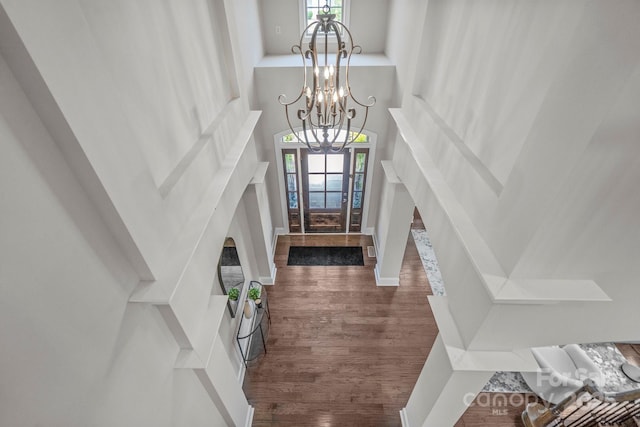 805 Hidden Pond Ln, Waxhaw, NC 28173 - entrance foyer with a chandelier, dark wood-style flooring, healthy amount of natural light, and a towering ceiling