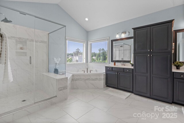 805 Hidden Pond Ln, Waxhaw, NC 28173 - bathroom with vaulted ceiling, a garden tub, marble finish flooring, vanity, and a marble finish shower