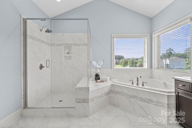 805 Hidden Pond Ln, Waxhaw, NC 28173 - bathroom with a garden tub, vaulted ceiling, marble finish flooring, a stall shower, and vanity