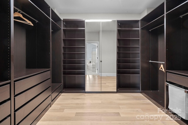 805 Hidden Pond Ln, Waxhaw, NC 28173 - walk in closet with wood finished floors
