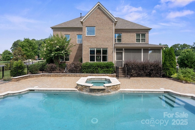 805 Hidden Pond Ln, Waxhaw, NC 28173 - view of pool featuring a sunroom, a pool with connected hot tub, and a patio area