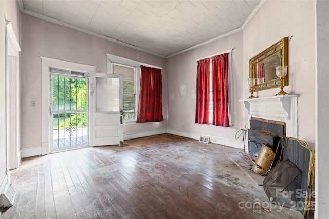 108 Walker St, Chester, SC 29706 - unfurnished living room with crown molding, wood-type flooring, and a fireplace