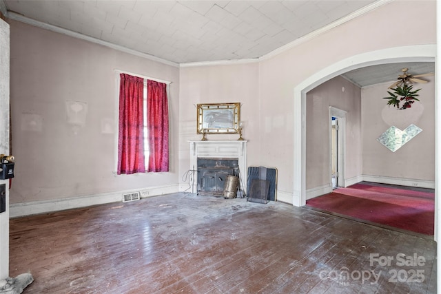 108 Walker St, Chester, SC 29706 - unfurnished living room featuring wood-type flooring, a fireplace, ornamental molding, and arched walkways