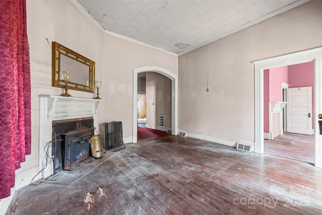 108 Walker St, Chester, SC 29706 - unfurnished living room featuring ornamental molding, arched walkways, a fireplace, and wood-type flooring