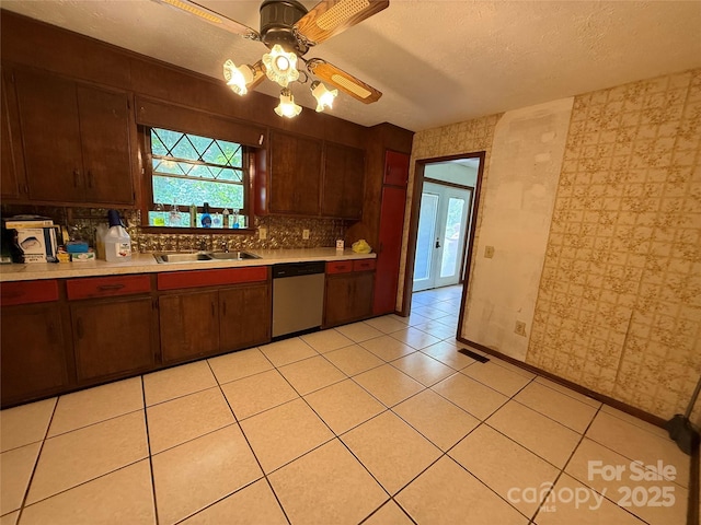 5422 River Rd, Granite Falls, NC 28630 - kitchen with stainless steel dishwasher, light countertops, decorative backsplash, a ceiling fan, and a textured ceiling