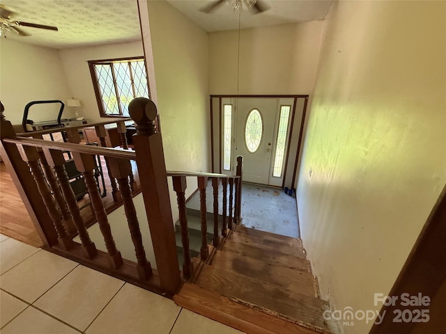 5422 River Rd, Granite Falls, NC 28630 - staircase featuring ceiling fan, plenty of natural light, and tile patterned flooring