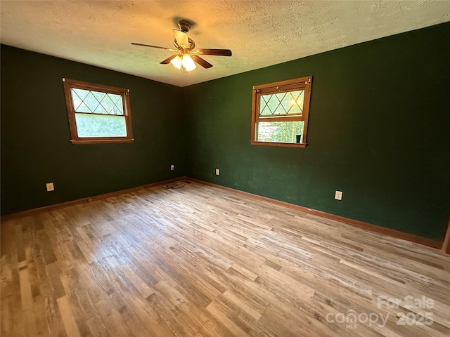 5422 River Rd, Granite Falls, NC 28630 - empty room featuring wood finished floors, a textured ceiling, and ceiling fan