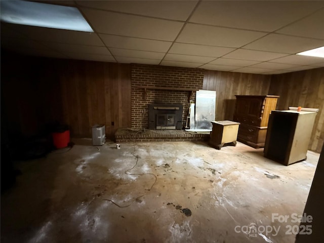 5422 River Rd, Granite Falls, NC 28630 - finished below grade area with wooden walls, a drop ceiling, and a brick fireplace