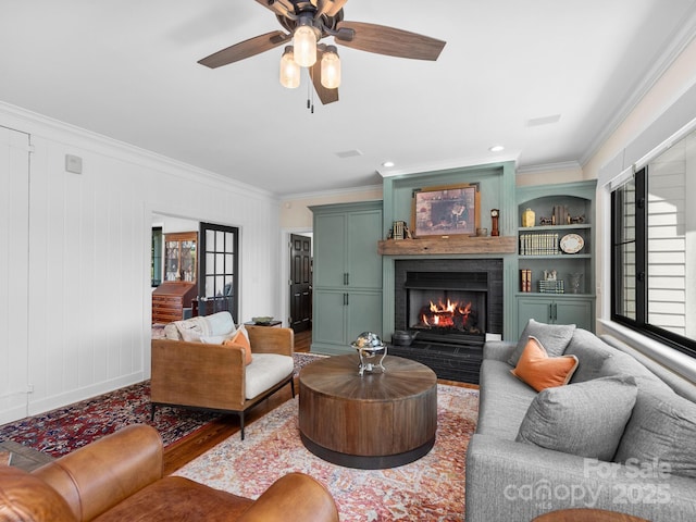 724 Moore Rd, Tryon, NC 28782 - living room with ornamental molding, wood finished floors, a fireplace, ceiling fan, and recessed lighting